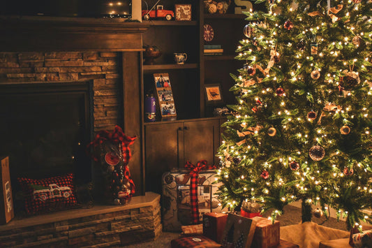 Christmas tree with lights and gifts in a homely setting
